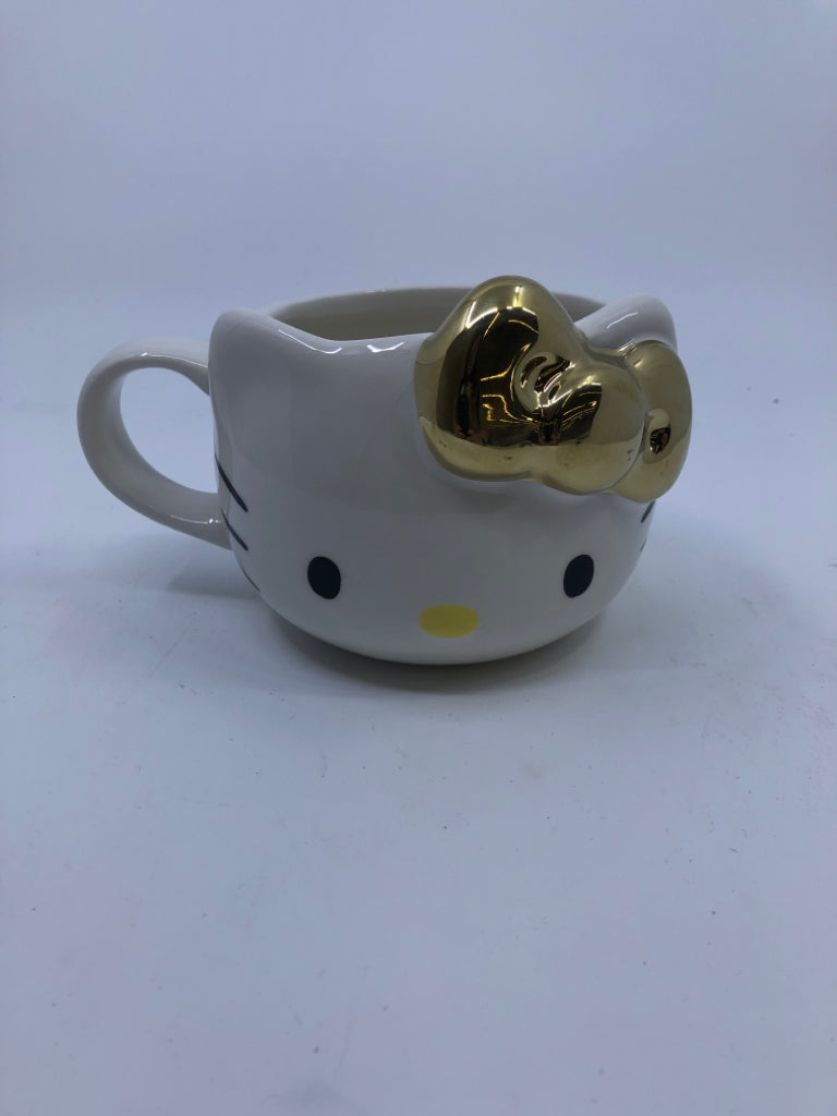 LARGE WHITE YELLOW KITTY MUG W/ GOLD BOW.