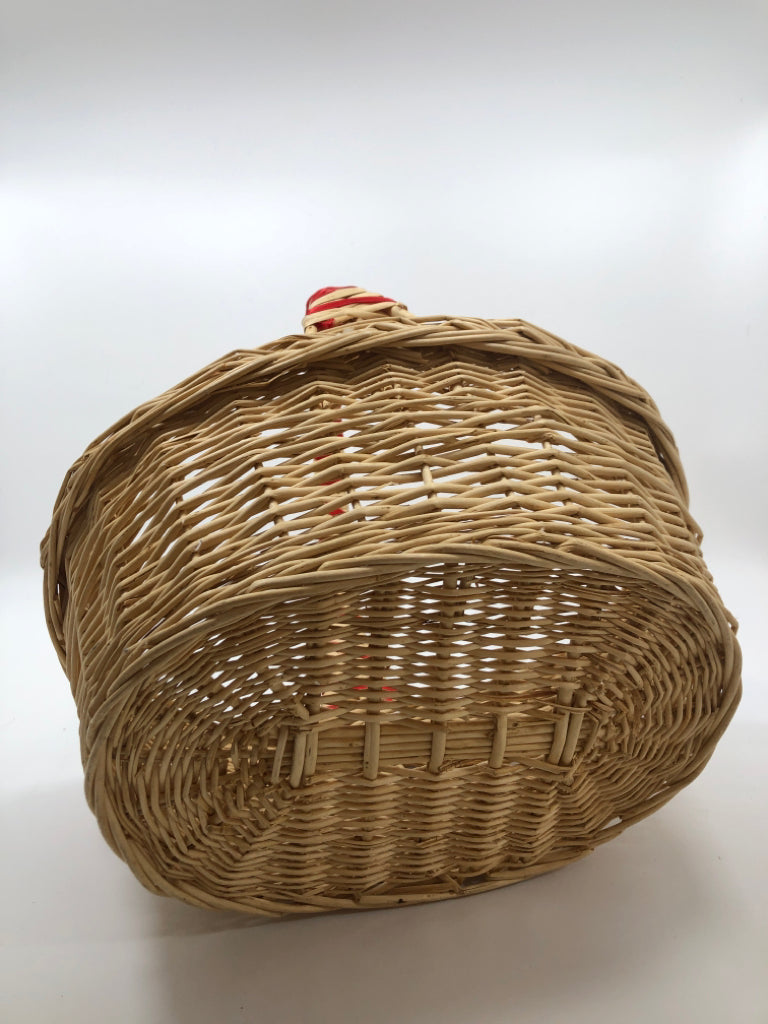 WICKER BASKET W/RED WRAP HANDLE.