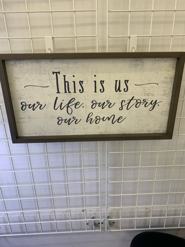 "THIS IS US" WALL ART GRAY WOOD BORDER W/ DISTRESSED BACKGROUND.