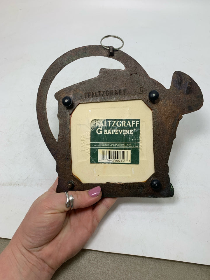 METAL TEAPOT SHAPED CERAMIC CENTER TRIVET.