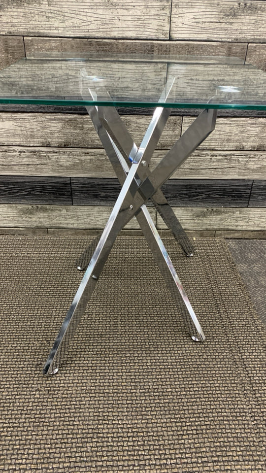 GLASS TOP SILVER METAL BASE SIDE TABLE.