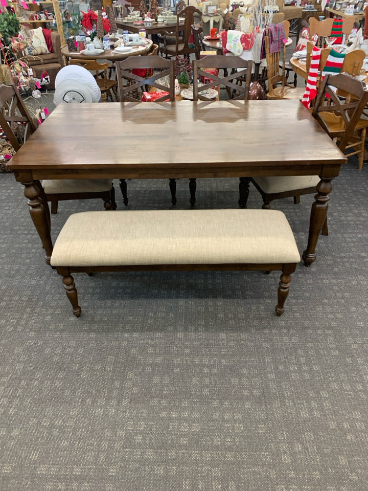 DARK WOOD TABLE W 4 CREAM CUSHIONED CHAIRS AND BENCH.