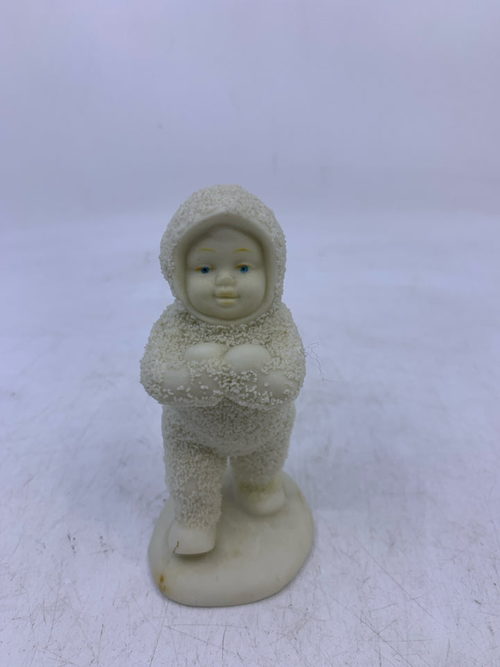 SNOW BABY HOLDING 2 SNOWBALLS WALKING.