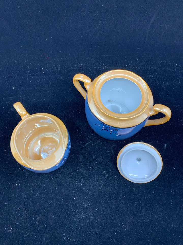 VTG BLUE AND ORANGE SUGAR AND CREAMER.