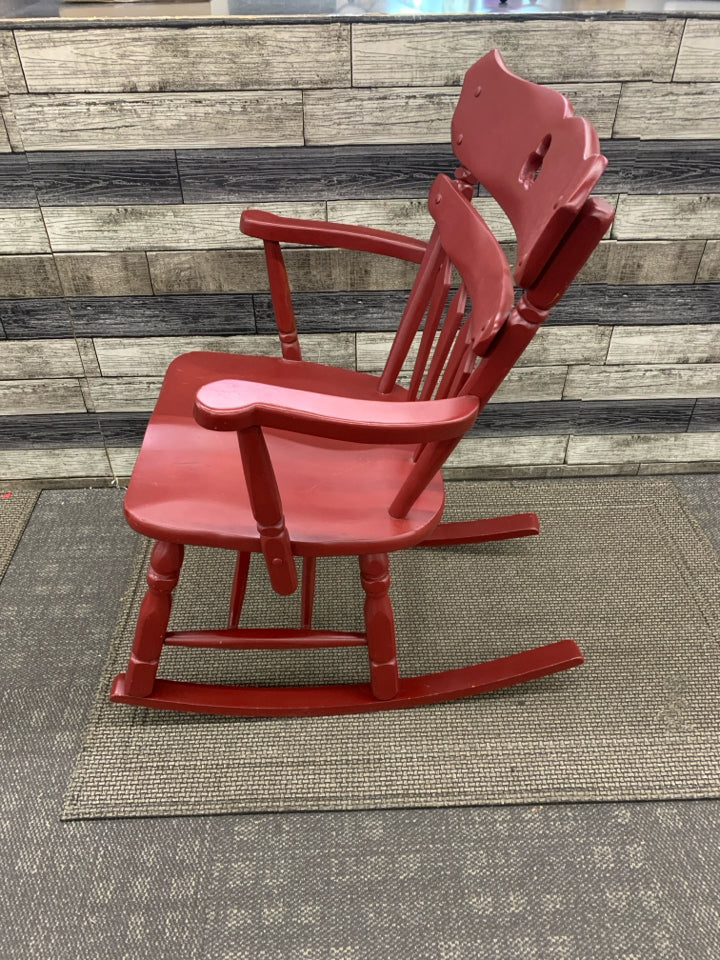 RED SHORT/ CHILDRENS ROCKING CHAIR.