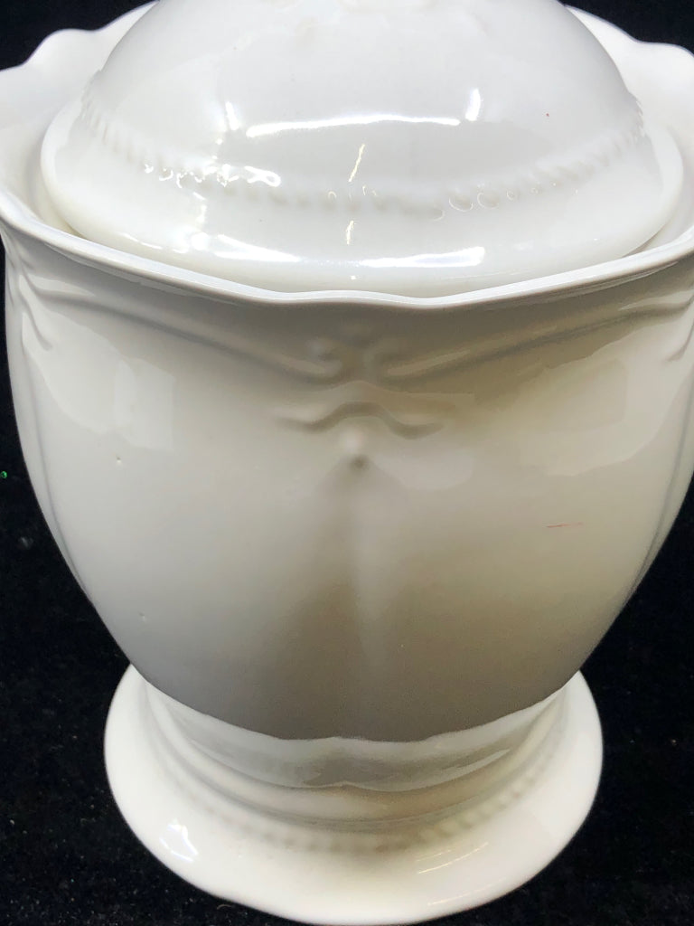 WHITE EMBOSSED FOOTED CANISTER W LID.
