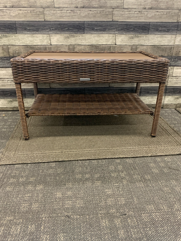 DARK WICKER W FAUX WOOD TOP COFFEE TABLE.