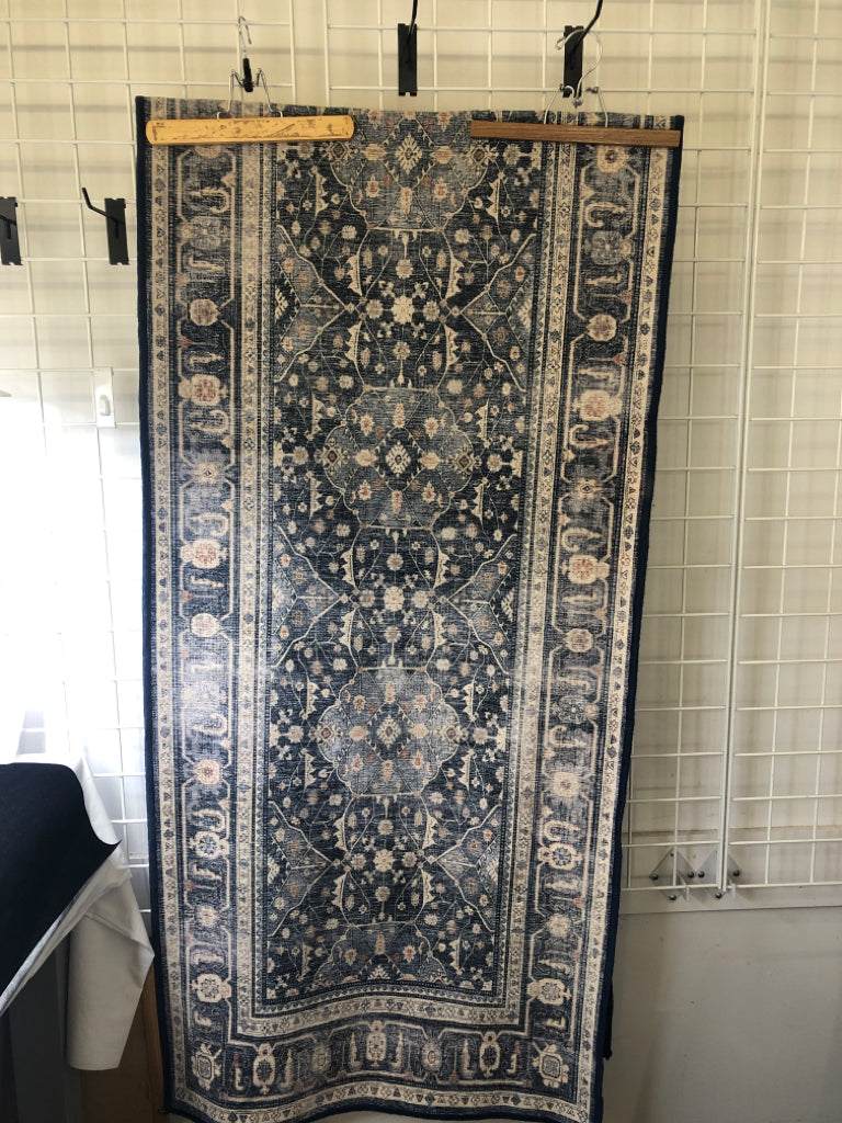 BLUE AND WHITE RUG RUNNER.