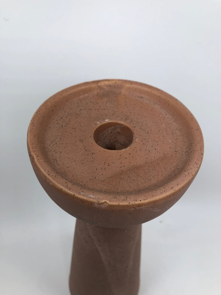 PINK STONE-STYLE CANDLE STICK HOLDER.