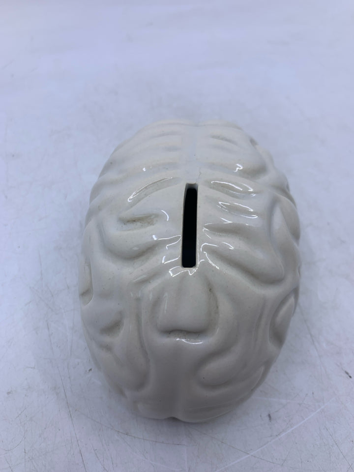 CREAM CERAMIC BRAIN COIN BANK.