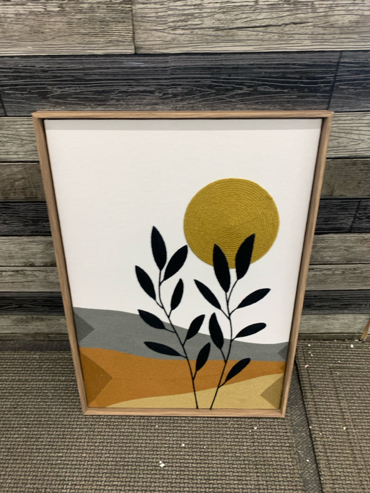 STITCHED SUN AND PLANTS HANGING IN TAN FRAME.