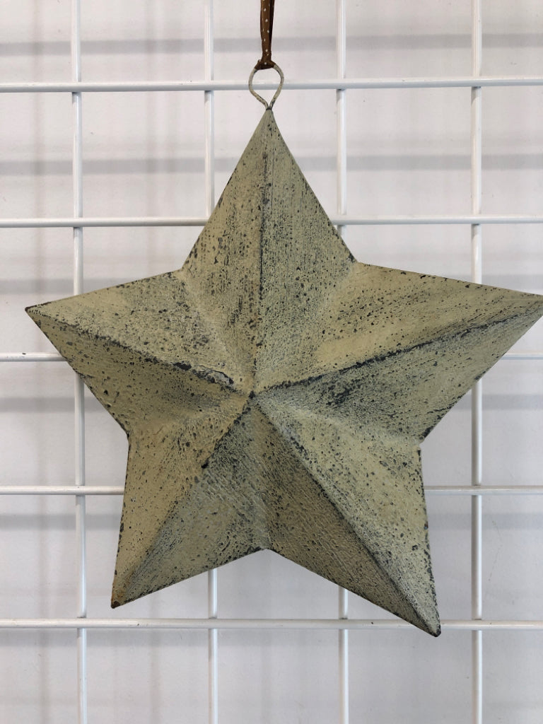 TAN WASHED METAL STAR HANGING.