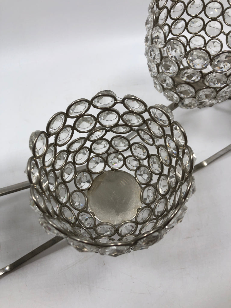 SILVER METAL AND CLEAR BEADED VOTIVE CANDLE HOLDER.