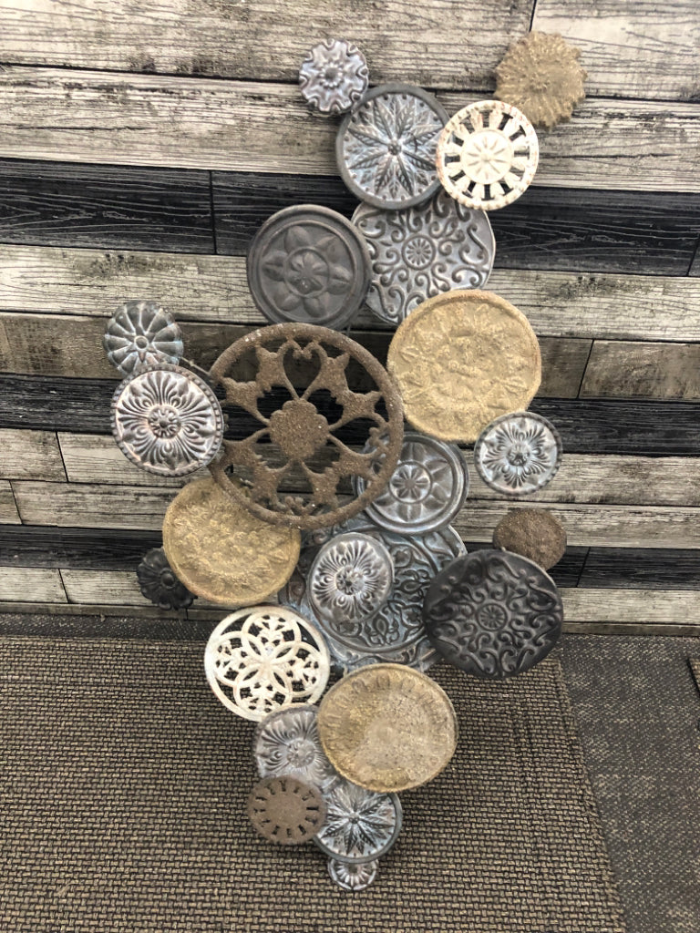 PUNCHED METAL MEDALLIONS WALL HANGING.