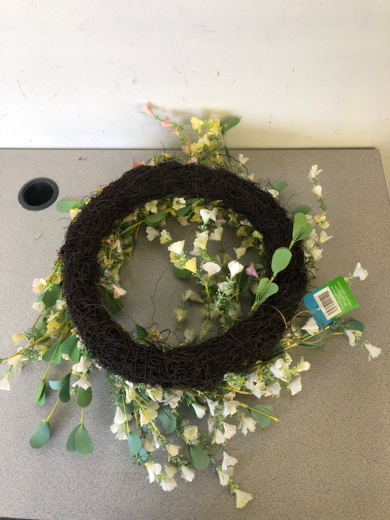 WHITE SMALL FLOWERS W/ GREEN LEAVES WREATH.