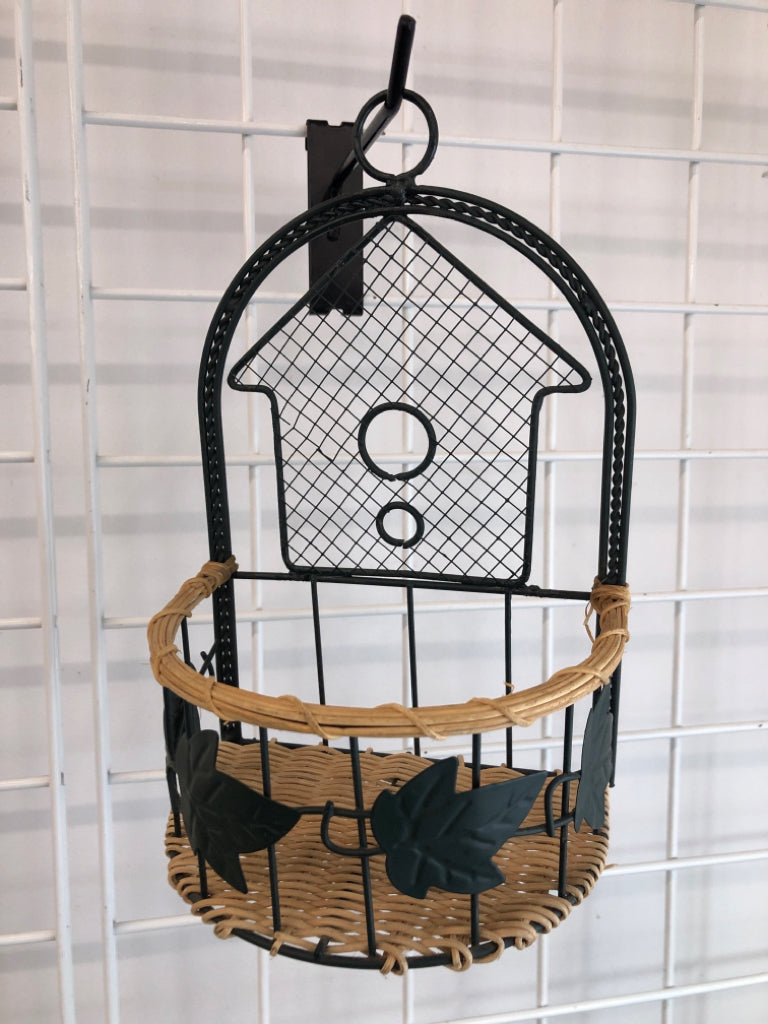 GREEN METAL SHELF W WICKER BASE.