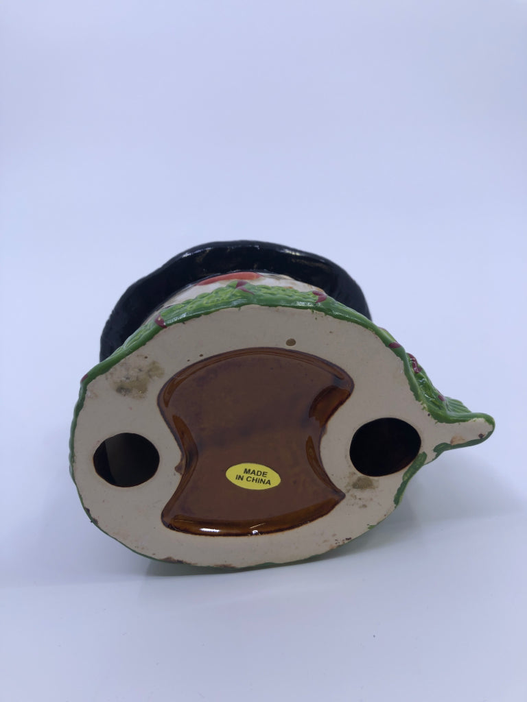 BROWN/WHITE SNOWMAN W GREEN SCARF CANDLE HOLDER.