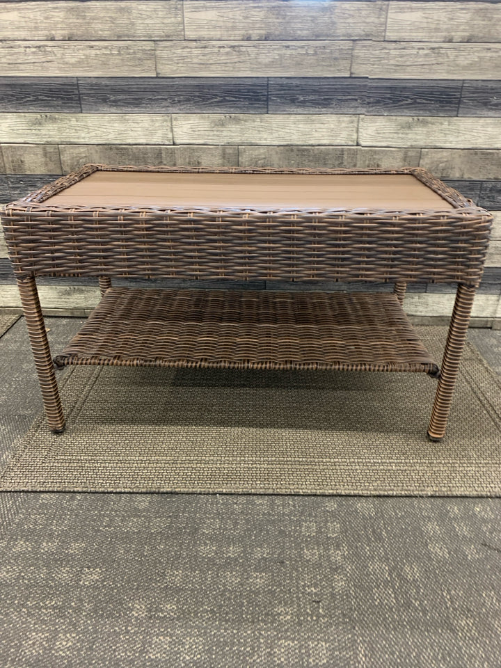 DARK WICKER W FAUX WOOD TOP COFFEE TABLE.