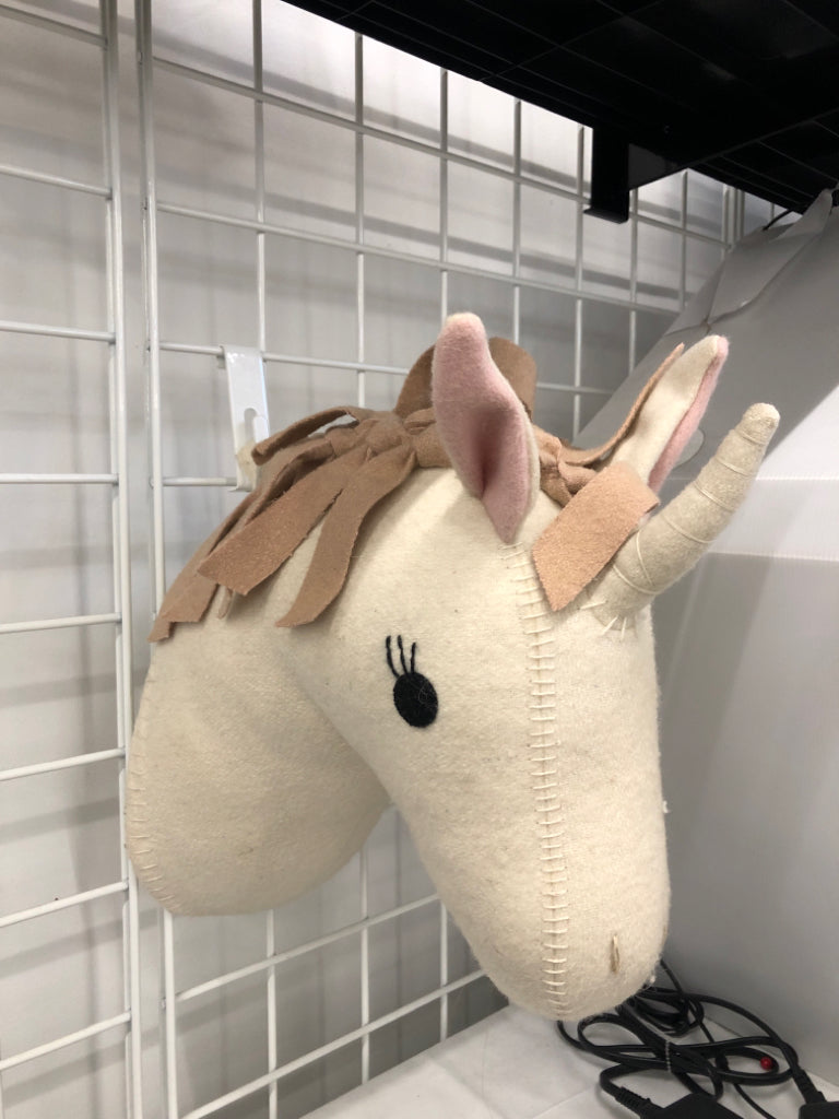 PLUSH UNICORN WALL HANGING.