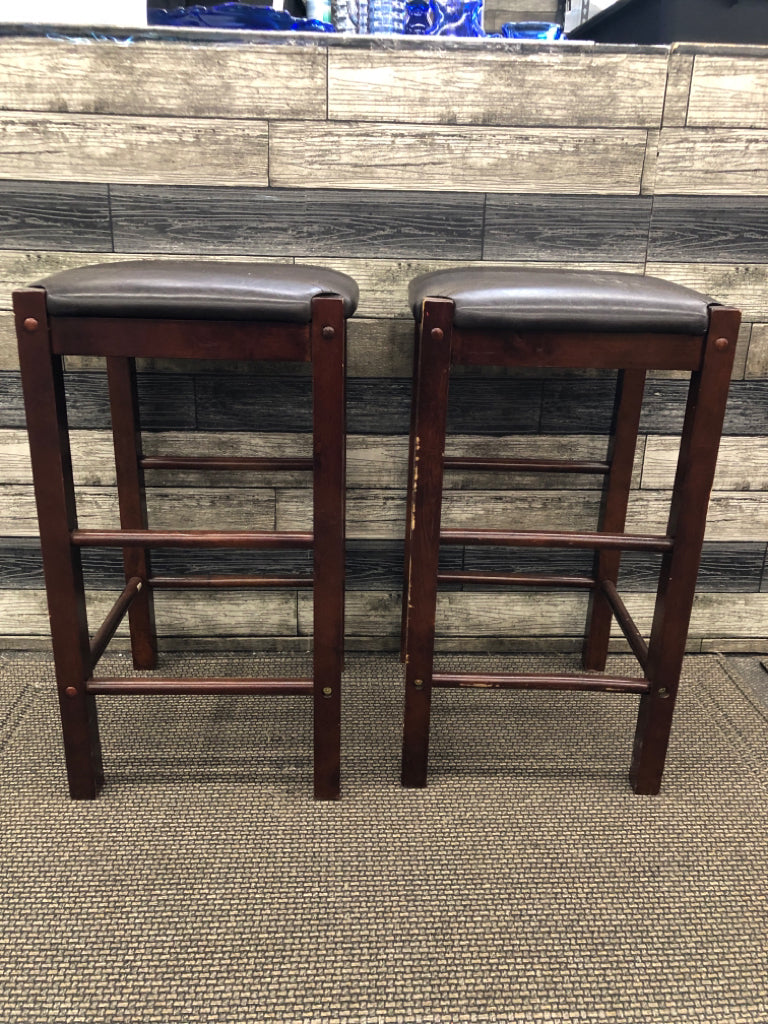 2 FAUX LEATHER UPHOLSTERED WOOD STOOLS.