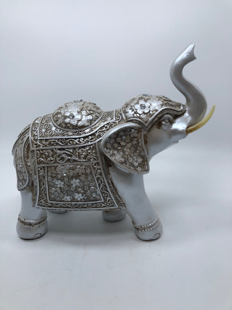 SILVER PAINTED RESIN ELEPHANT.