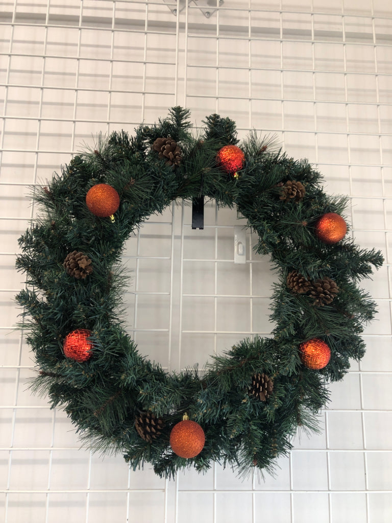 CHRISTMAS PINECONE AND RED ORNAMENT WREATH.