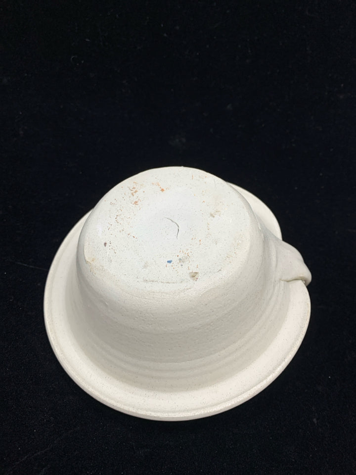 BLUE FLORAL POTTERY CANDLESTICK HOLDER.
