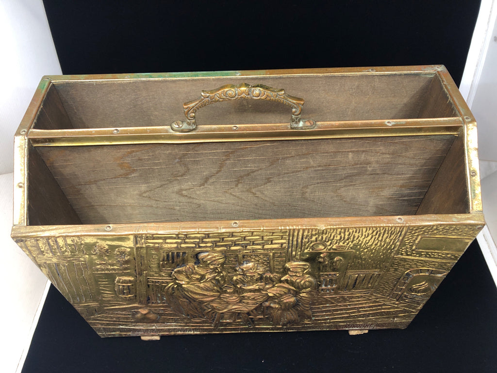 VTG BRASS MAGAZINE HOLDER W/EMBOSSED DESIGN FAMILY BAKING IN COTTAGE.