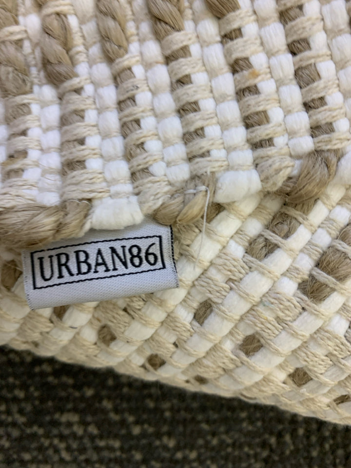 BROWN AND WHITE TASSEL AREA RUG.