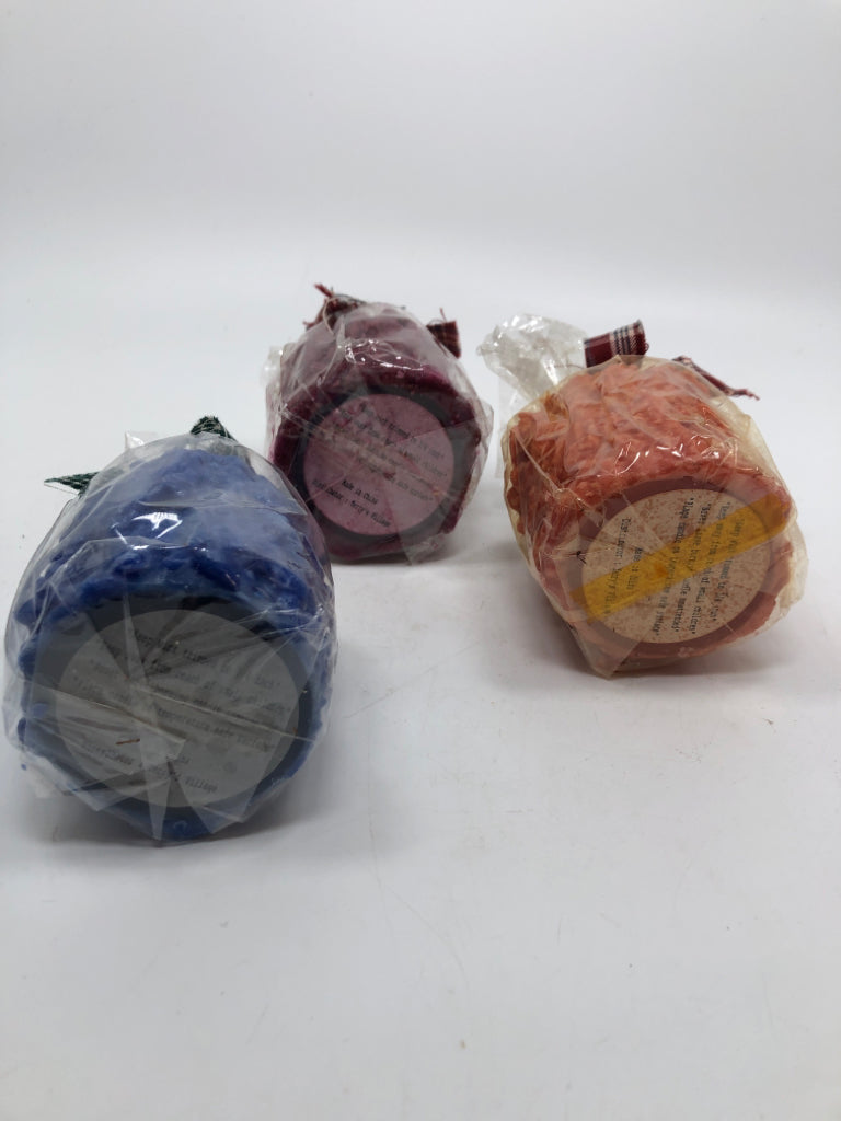 3 MULTI-COLORED TERRY'S VILLAGE CANDLES.