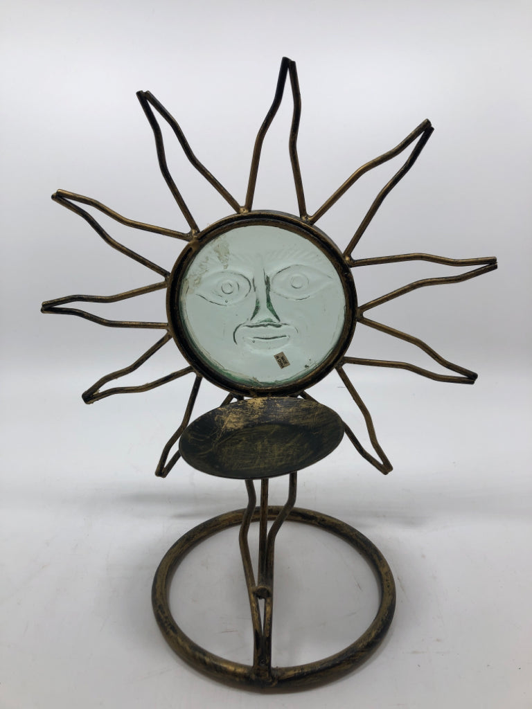 GOLD METAL AND GLASS SUN FACE CANDLE HOLDER.
