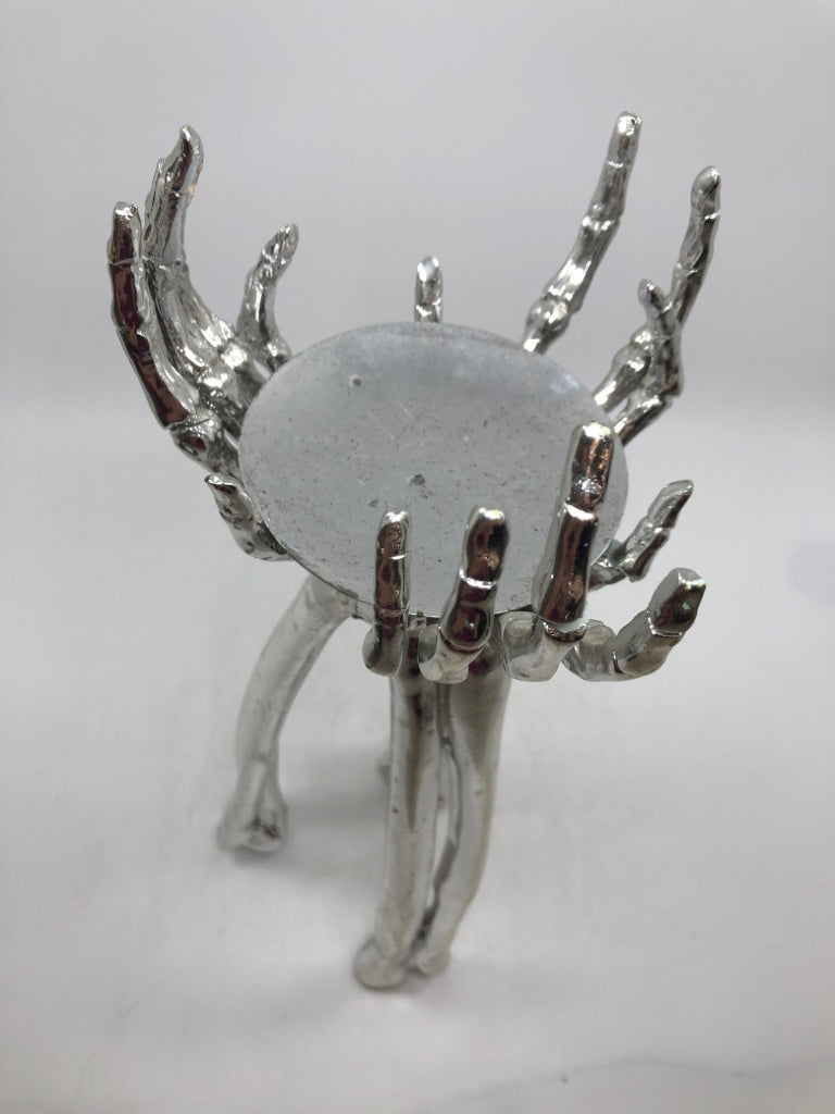 SILVER SKELETON HANDS PILLAR CANDLE HOLDER.
