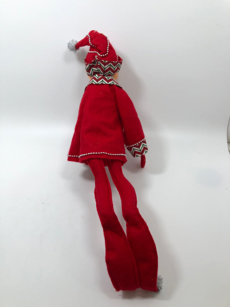 ANNALEE RED LONG LEGGED ELF DRESSED IN RED.