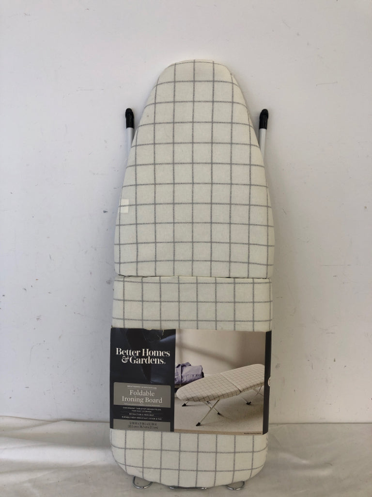 NIP FOLDABLE IRONING BOARD.