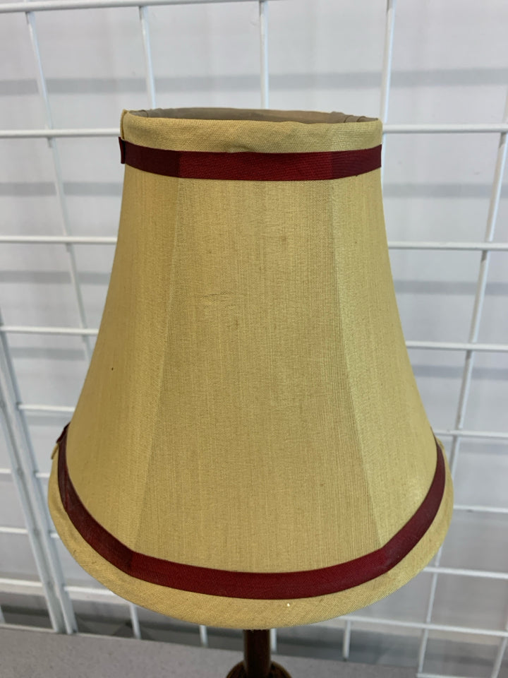 BROWN/RED BASE LAMP W/RED STRIPE SHADE.