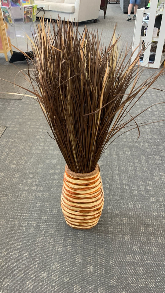 FAUX GRASS IN LARGE WOVEN BASKET VASE.