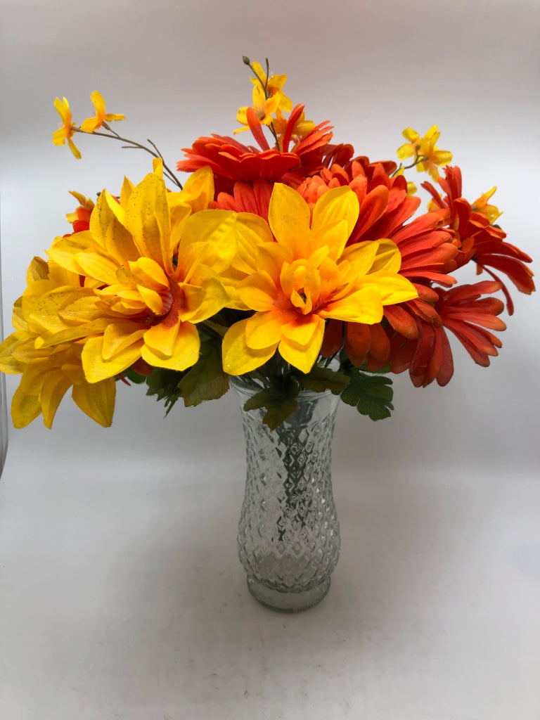 ORANGE FLORALS IN TEXTURED GLASS VASE.