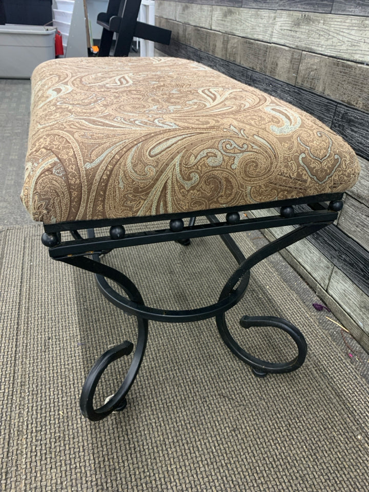 BROWN PAISLEY AND BLACK SCROLL BASE FOOTSTOOL.