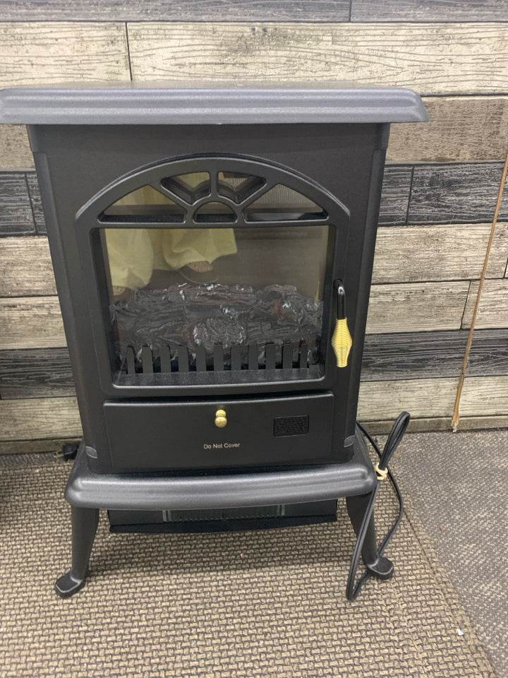FOOTED ELECTRIC FIREPLACE W/ FAUX LOGS.