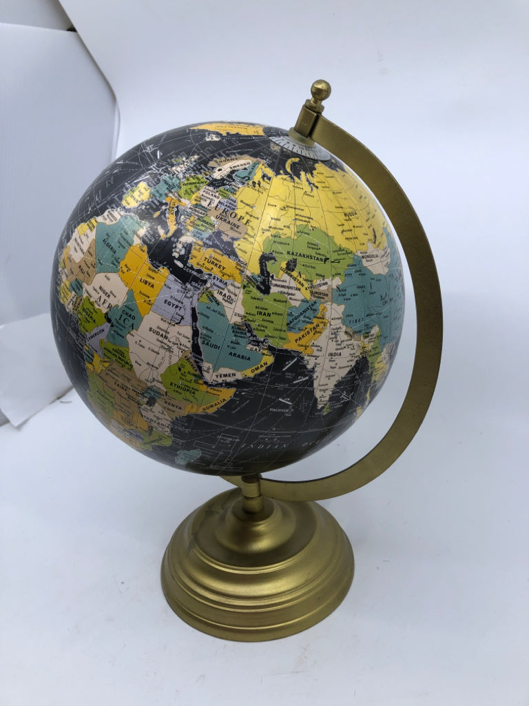 BLACK GLOBE ON GOLD STAND.