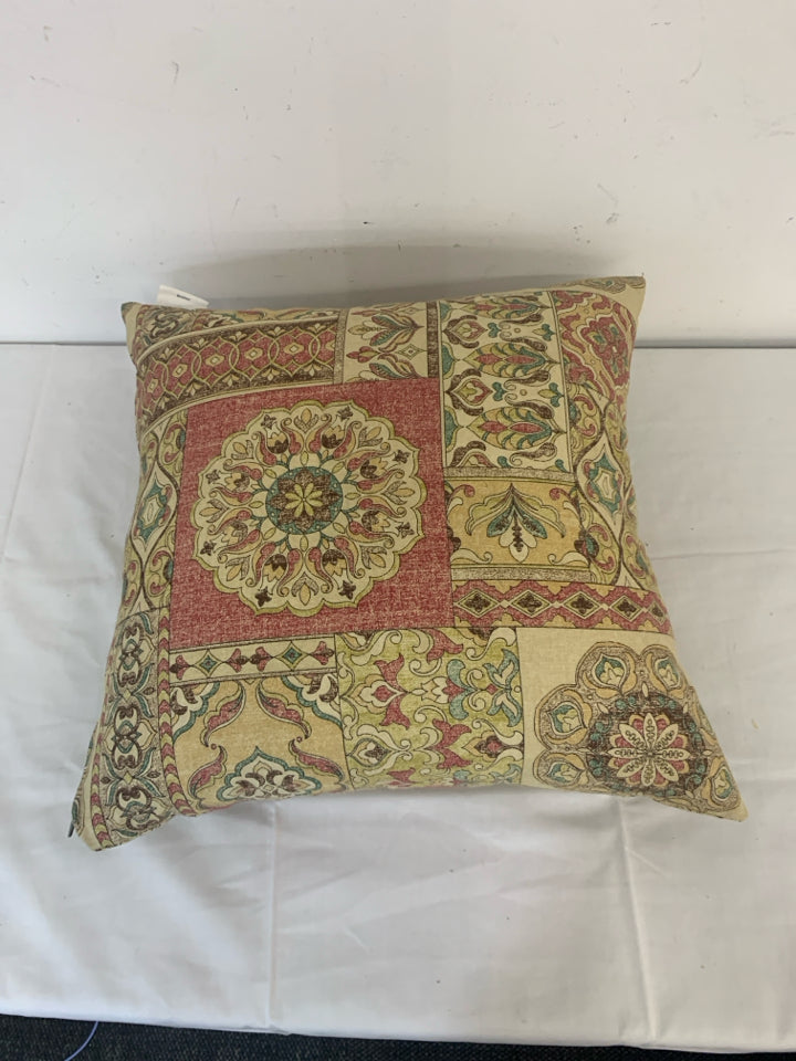 RED AND TAN MANDALA PATTERN PILLOW.