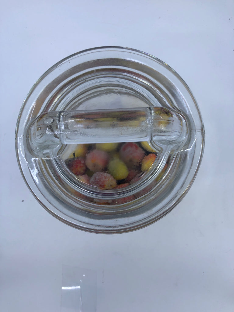 CLEAR GLASS HANDLED JAR W/FAUX GLITTER FRUIT.