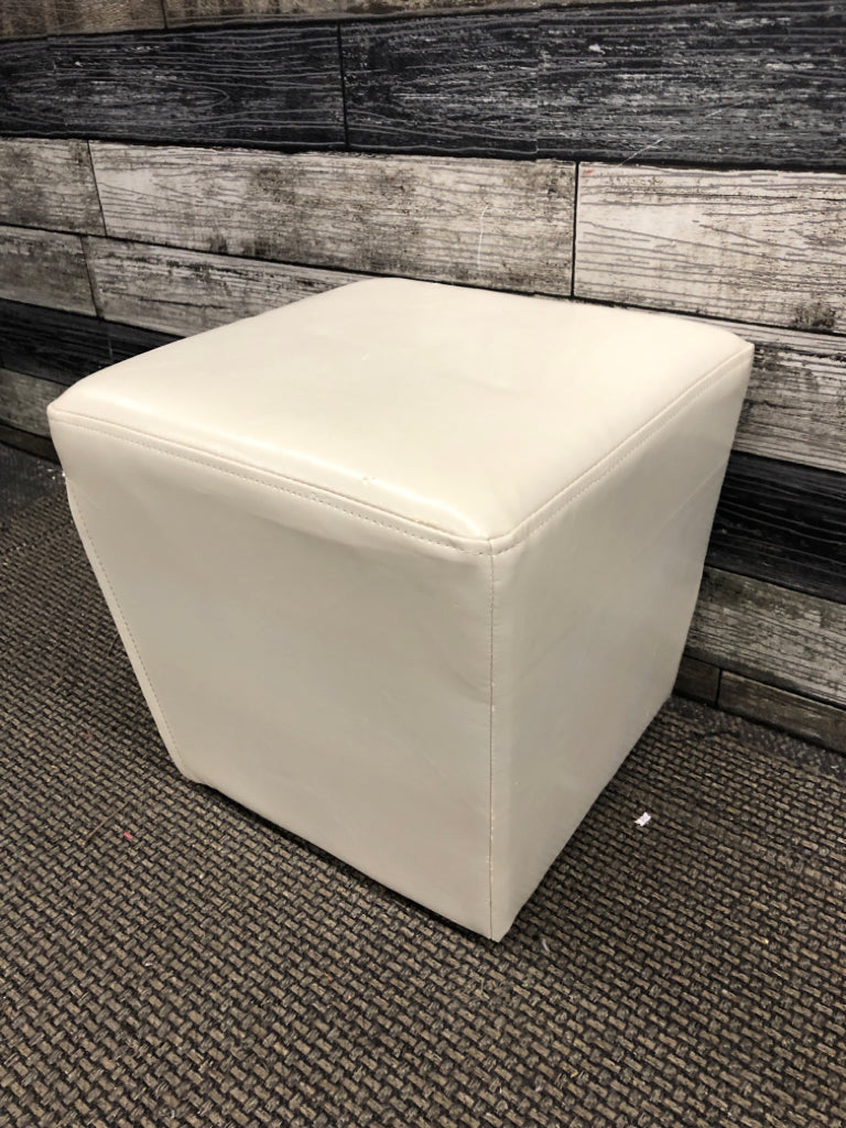 WHITE FAUX LEATHER OTTOMAN.