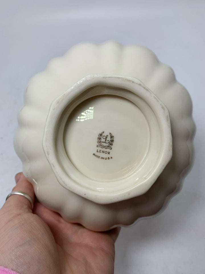 FOOTED CANDY DISH W/ UNEVEN GOLD EDGE.