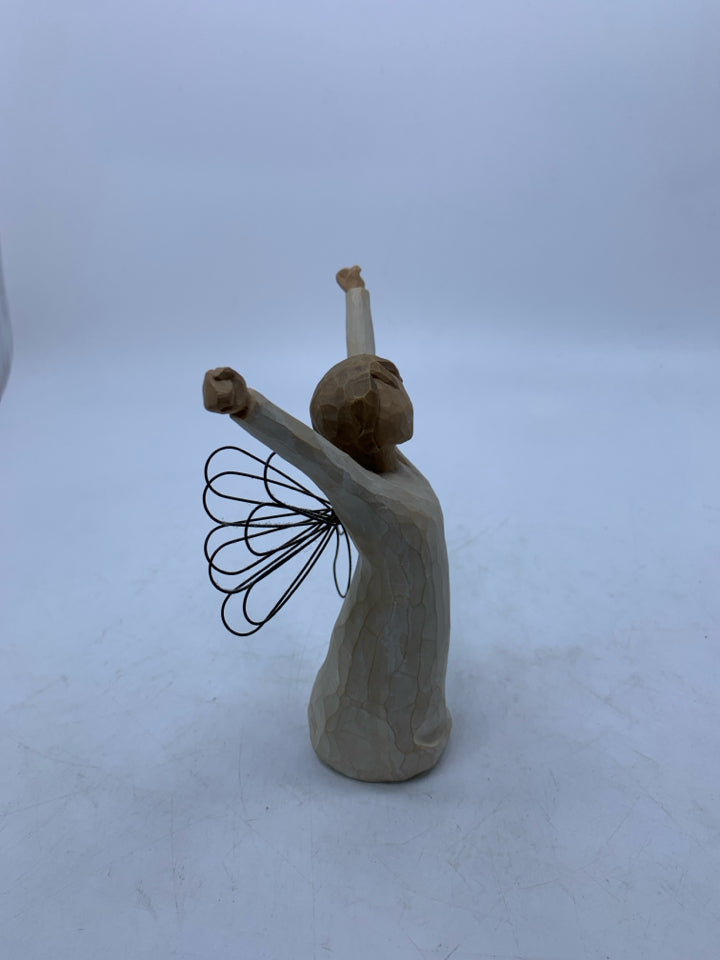 ANGEL OF COURAGE HOLDING HANDS UP.