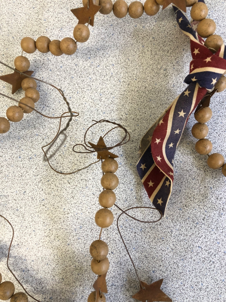 PRIMITIVE BEADED WIRE GARLAND W/BOW.