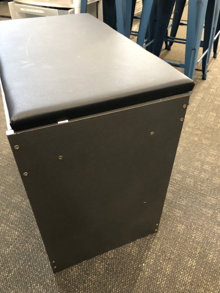 SHOE STORAGE W/PADDED FLIP TOP.
