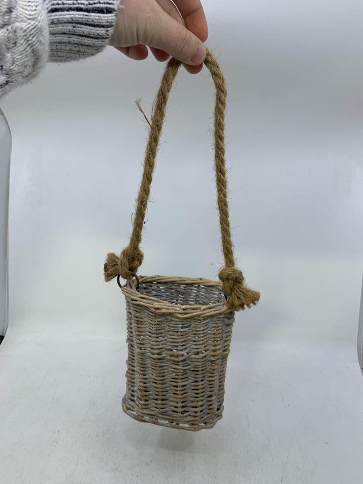 SMALL WHITE WASHED BASKET W/ LONG TWINE HANDLE.