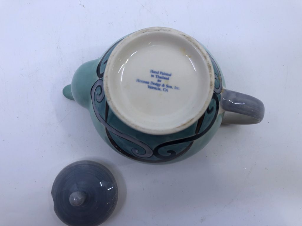 TEAL TEAPOT W/PURPLE PAINTED LID.