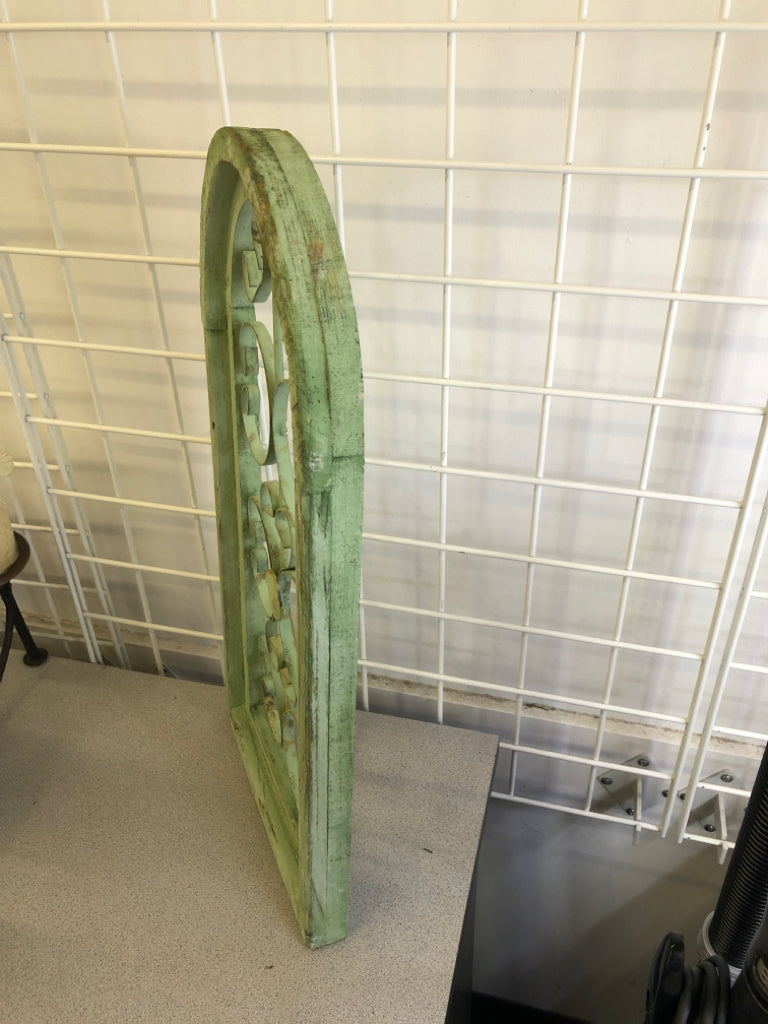 DISTRESSED GREEN PAINTED ARCH W/ METAL SCROLL WALL ART.